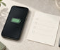 Editorial illustration of a smartphone battery symbol beside a blank repair checklist